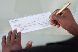 Person signing a check