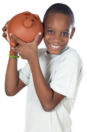 boy holding piggy bank