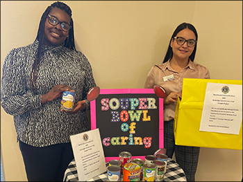 employees collecting canned food for a food drive